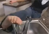 OCD girl kicks the faucet to shut off water after scrubbing her hands clean.